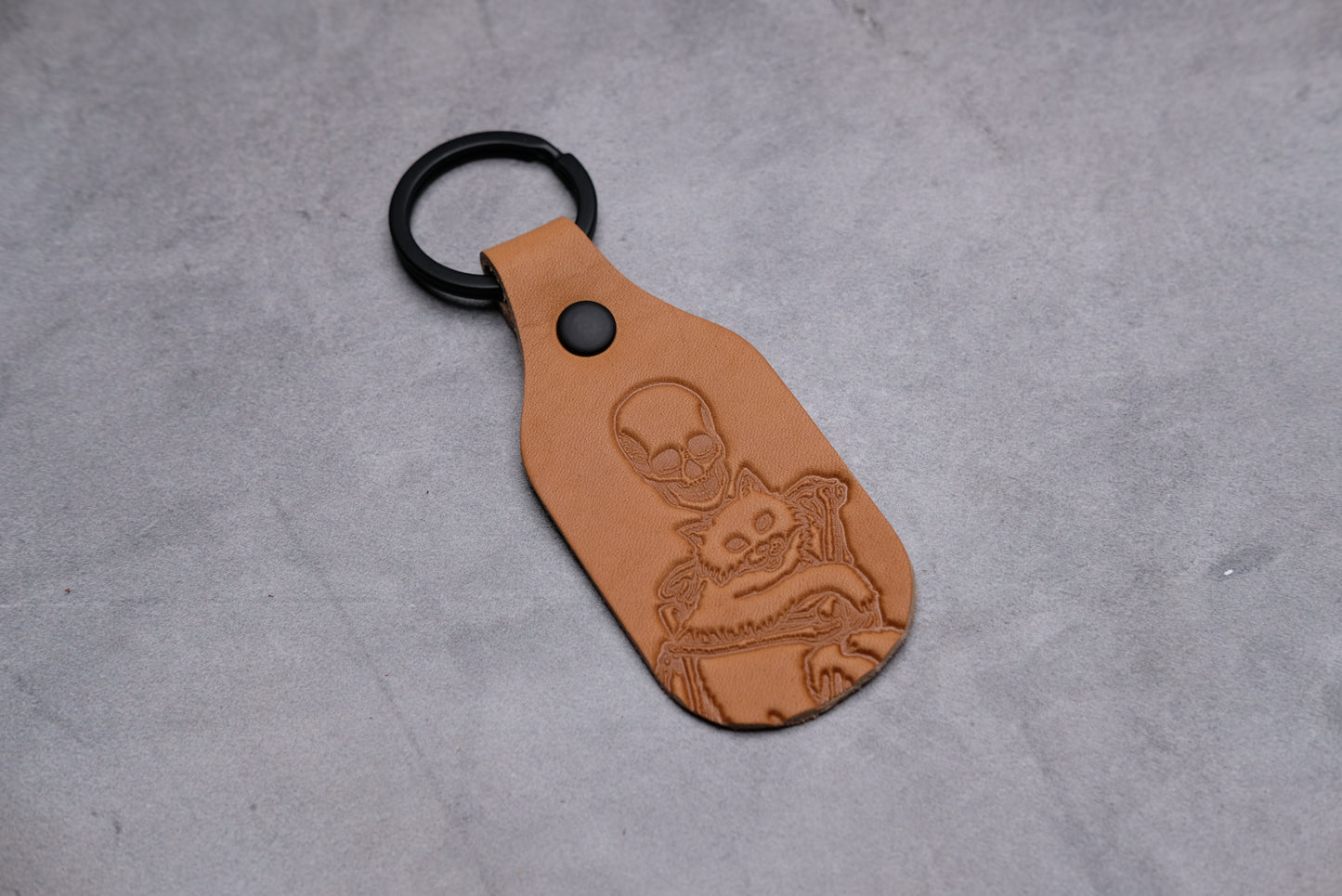 Skeleton holding a cat - Leather Keychain