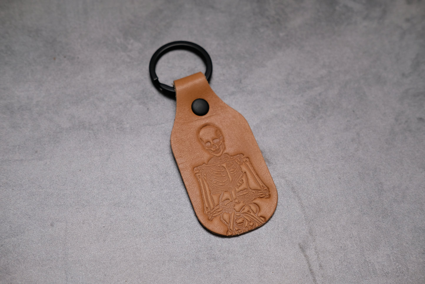 Skeleton holding a Book - Leather Keychain