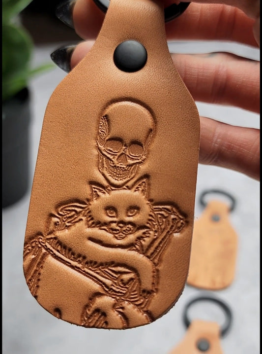 Skeleton holding a cat - Leather Keychain