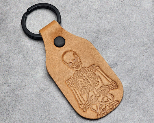 Skeleton holding a Book - Leather Keychain